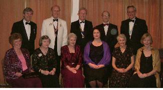 Back row, left to right, John Whittock, Vice President, 2003-2004. Brian Dawson, District Governor, 105W, 2003 - 2004.
Robert Briggs, President, 2003-2004. John Redmond-Lion, Rotary President.
Alan Denham, Secretary, and District Governor Elect, 2004-2005.
Front row, left to right, Di Whittock. Pat Dawson. Margaret Briggs. Dr Susanne Briggs (President's daughter),
Bridget Smith. Jean Denham.