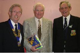photo, left to right, President, Robert Briggs, New member, Leslie Fox and Secretary, Alan Denham